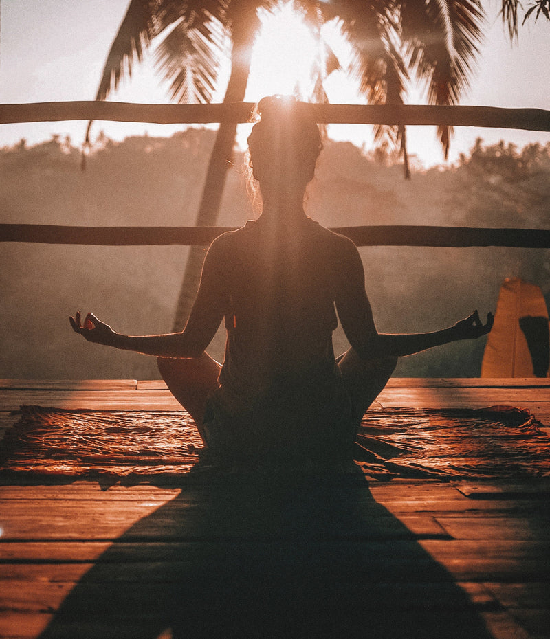 Person meditating outdoors